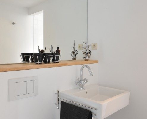 Bathroom sink mirror with shelf