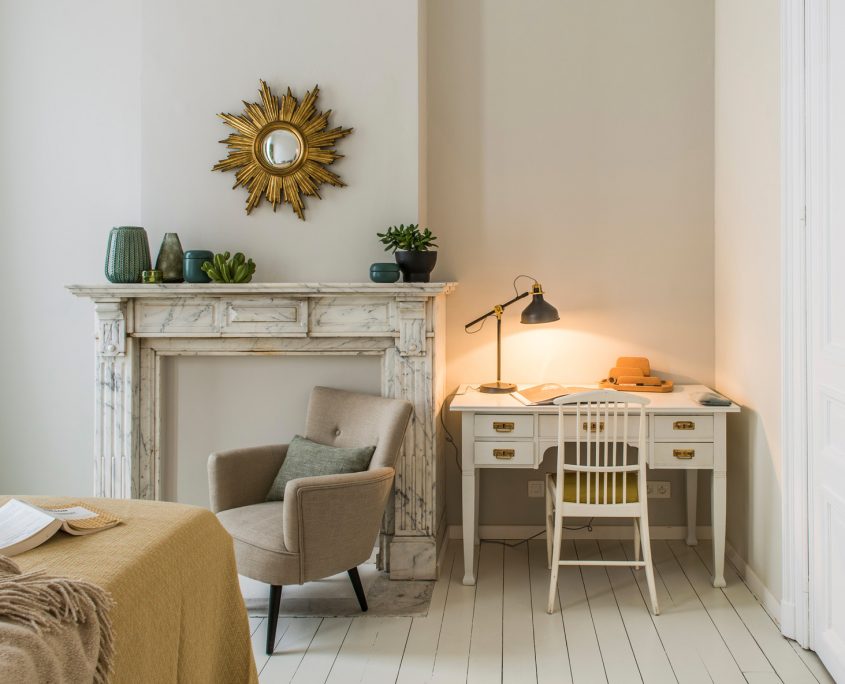 Example of a working area with a desk in our private furnished rooms at House Louise in Brussels.