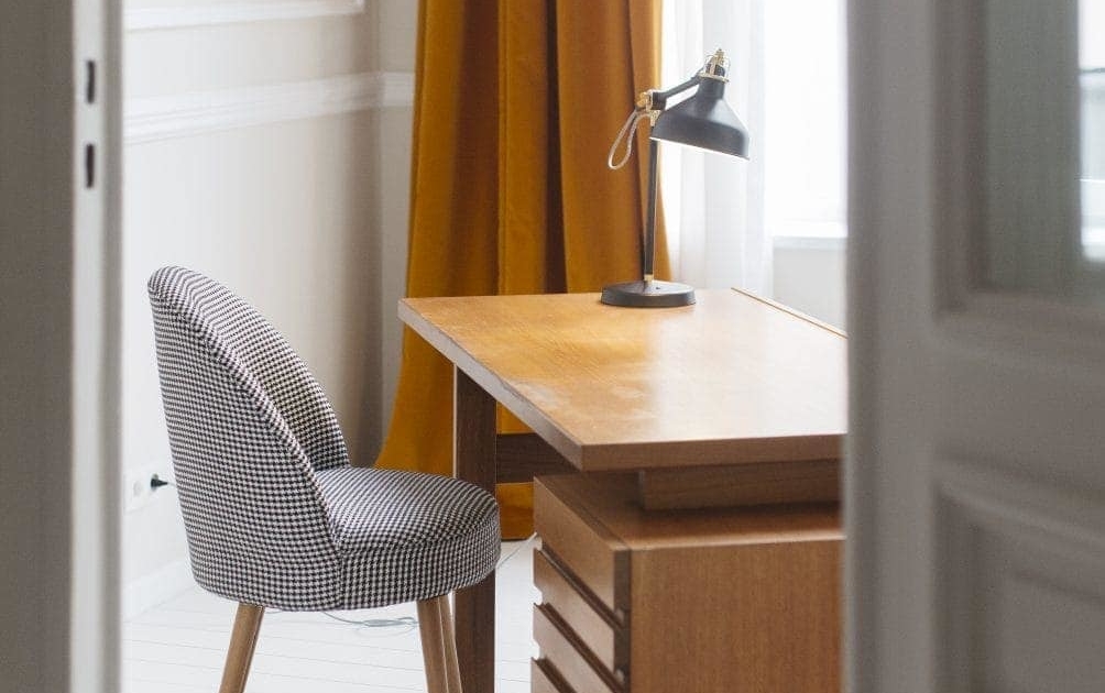 Vintage 1930's wood veneer desk with houndstooth chair