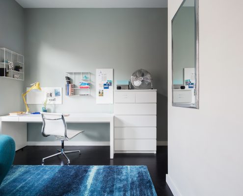 White drawers next to desk