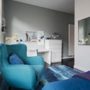 Blue chair across from mirror
