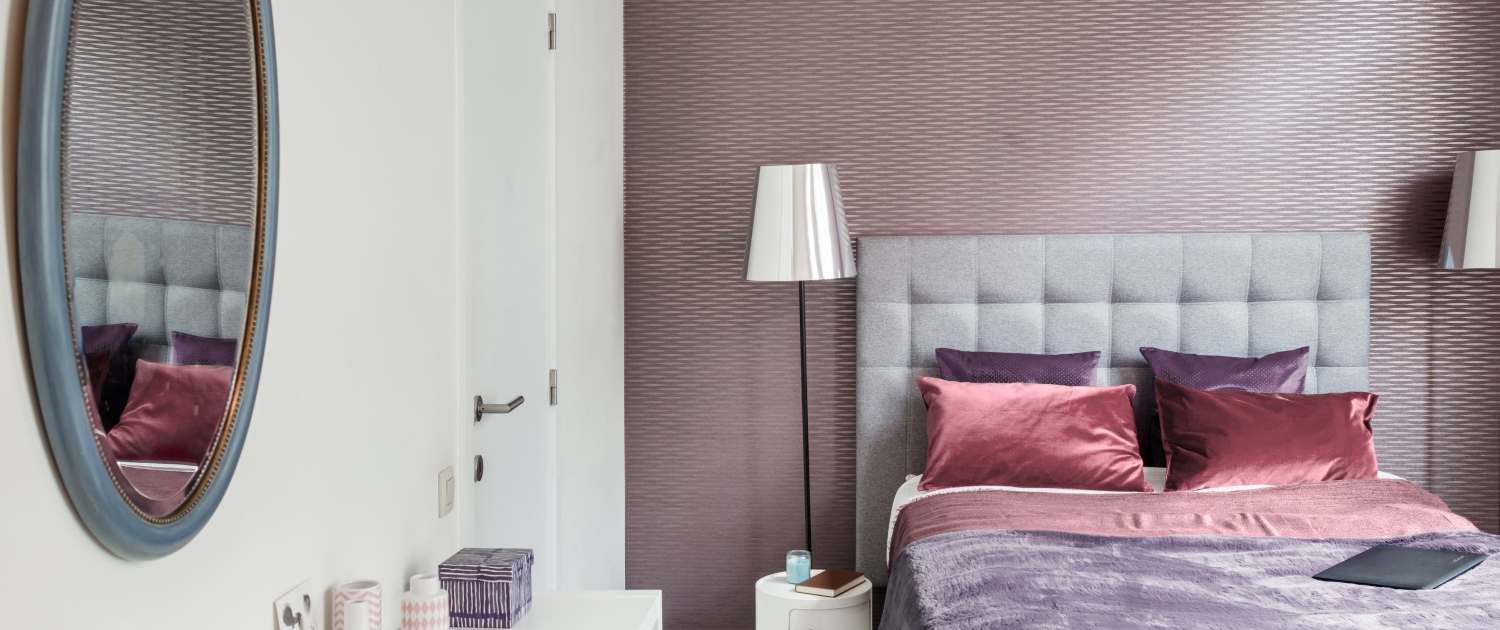 Purple wallpapered room at Morton Place with double bed