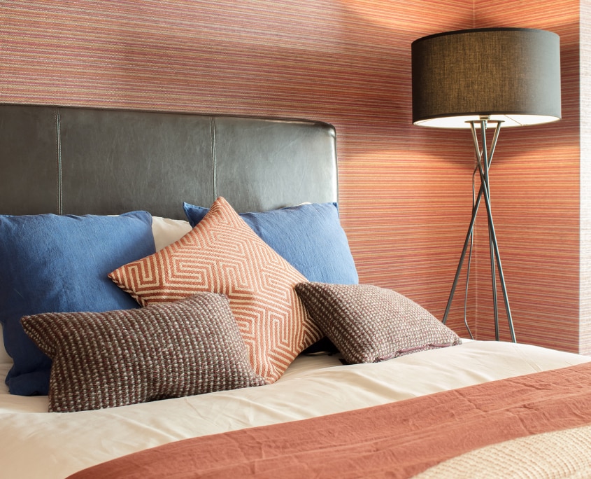 Bedroom View of pillow and omexco wallcovering red 