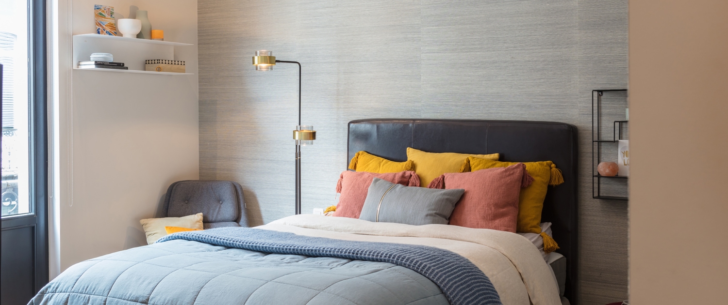 Grey wall room bed and white shelves