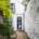 Maison arriere facade rose porte noire colocation Morton Place Chatelain
