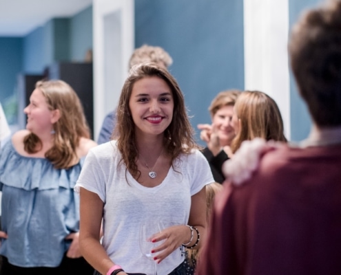 Happy young woman at party Brussels