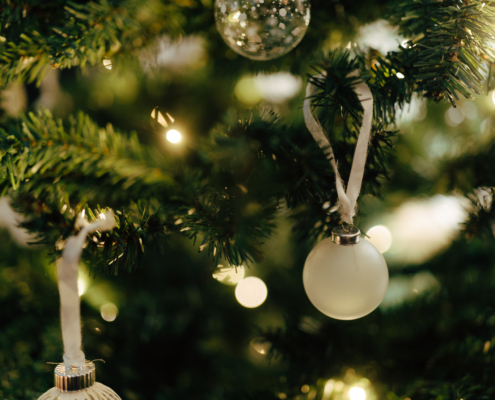 Close-up of Christmas ornaments and warm lights at Morton Place Brussels.